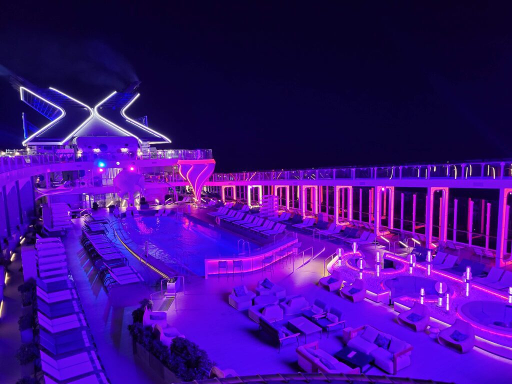 The Celebrity Beyond pool deck at night. 